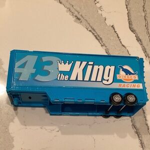 Disney Pixar Cars Dinoco Hauler Transforms to race track